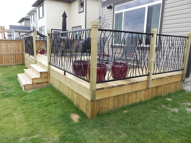 BENT railing design on a custom outdoor deck - Modern ...