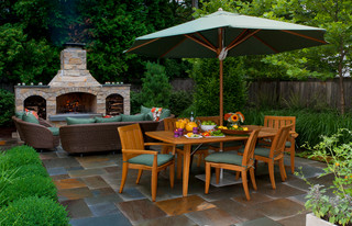 Outdoor dining room with fireplace.
