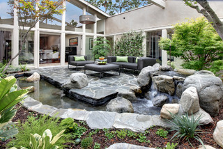 Courtyard with waterfall and pond.