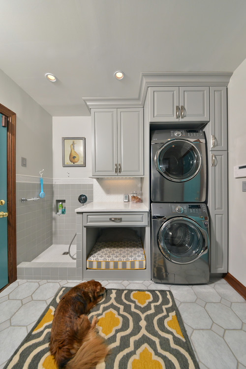  Laundry room/doggy room with built in pet shower, bed and rug to relax on.
