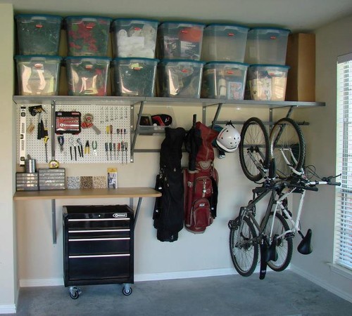 DIY garage organization should make use of your walls like the example shown here ...