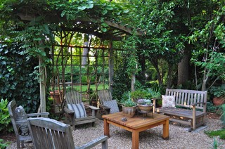Rustic outdoor seating area with lath fence.