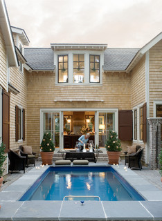 Small wading pool in courtyard of house.