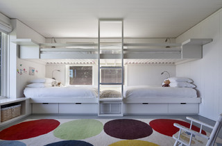 Modern bunk room with direction lights and storage for each of the 4 beds.