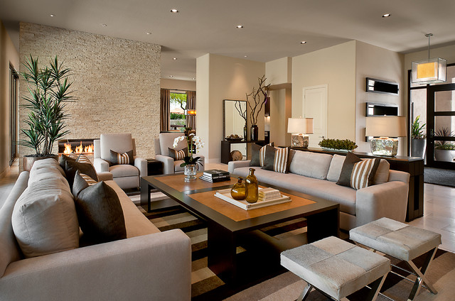 Contemporary living room with neutral colored sofas arranged symmetrically