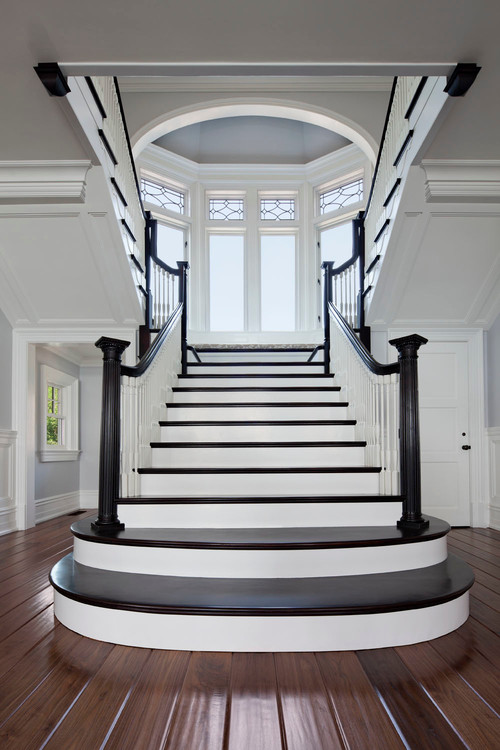 elegant staircases created with contrasting white paint and dark stained wood treads
