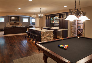 traditional basement with wide plank flooring